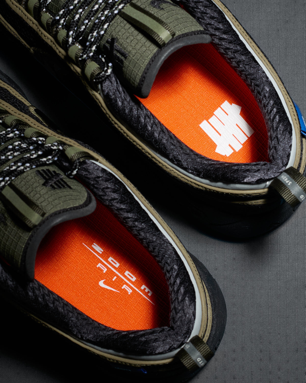 UNDEFEATED x Nike Air Zoom Spiridon Sneakers – Black & Olive